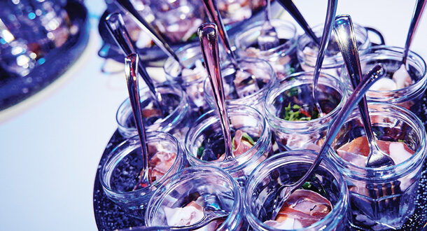 Catering tray with snacks in glasses